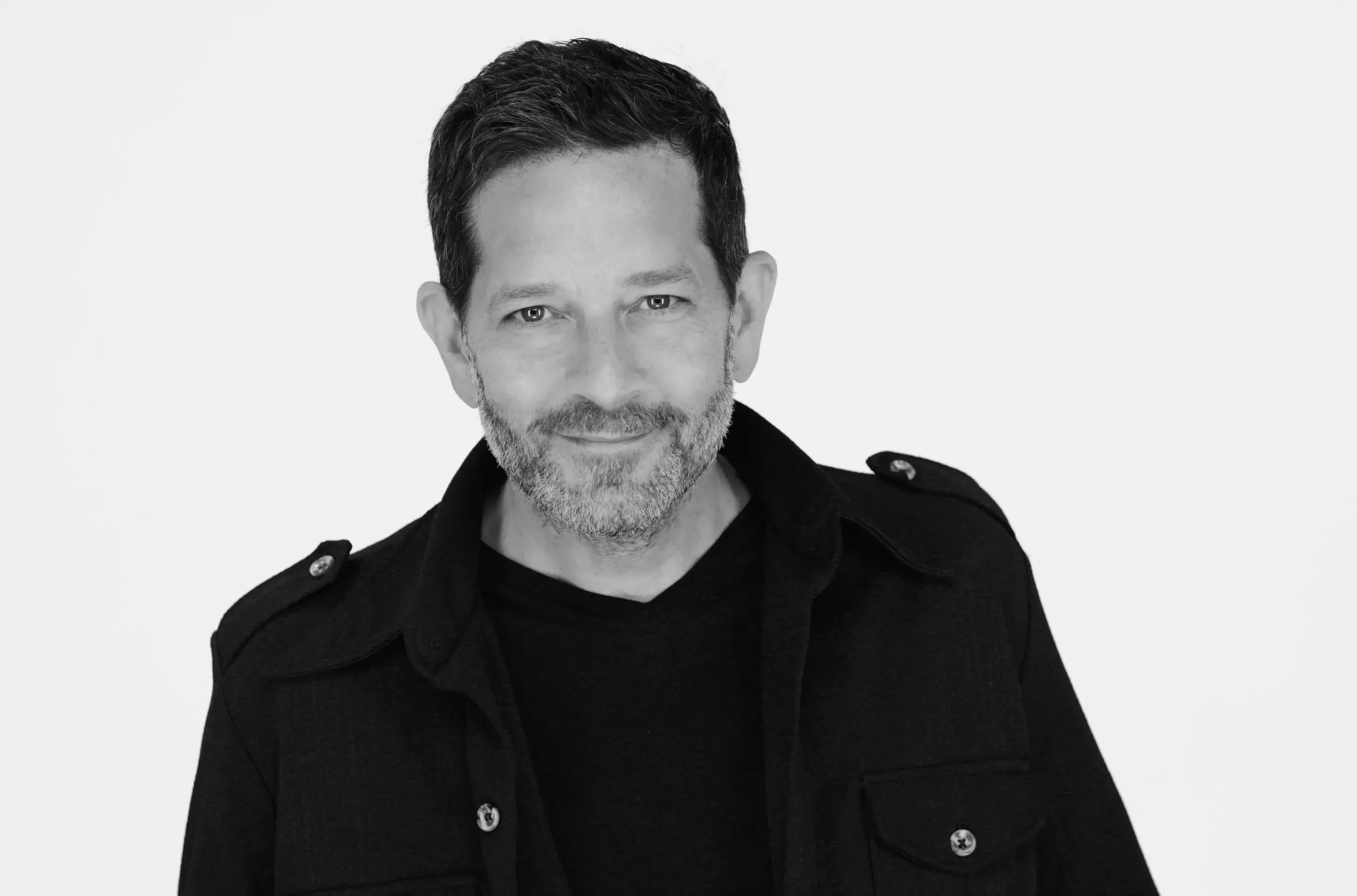 J Barbush black and white headshot